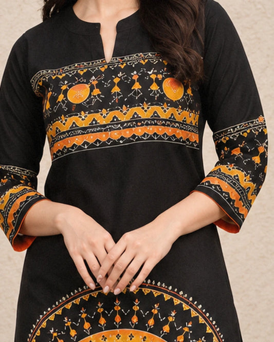 lose-up of notched collar and orange folk art yoke band on black cotton kurta