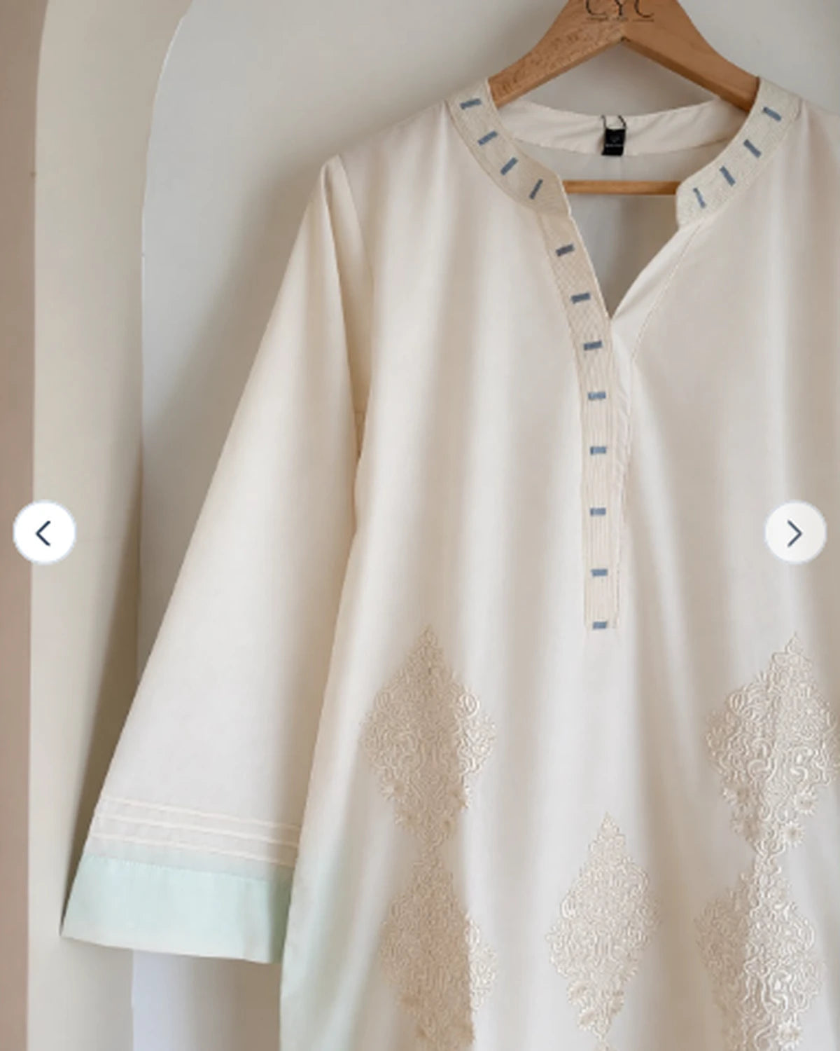 Full-length ivory embroidered cotton kurta, front flatlay view