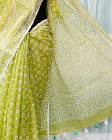 Lime green bandhani batik saree draped showing tassel border