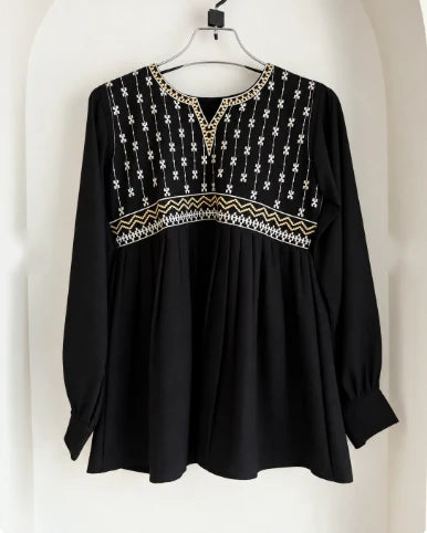 Black embroidered cotton peplum kurti with gold and white yoke embroidery, on hanger