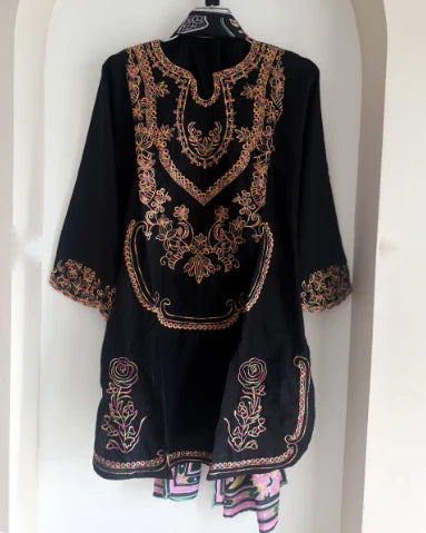 Black embroidered cotton kurta with multicolor floral embroidery, front view on hanger