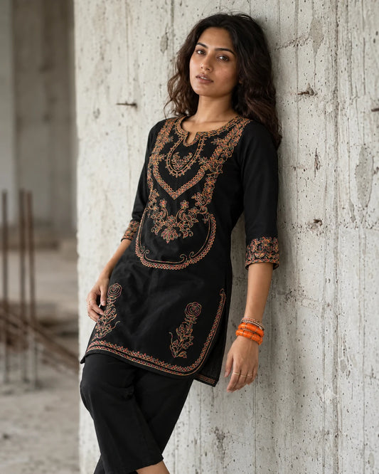 Woman wearing black cotton kurta and pants set with multicolor embroidery