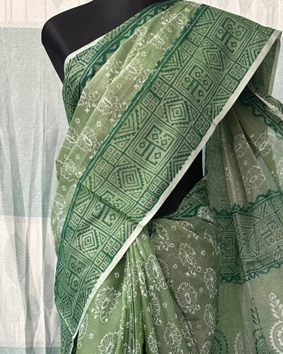 Green block print saree pallu with tassel border close-up
