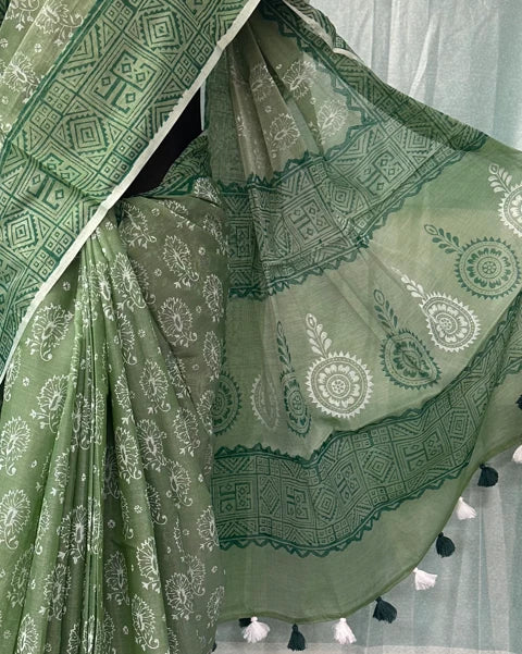 Green muslin saree floral print with black and white tassel detail