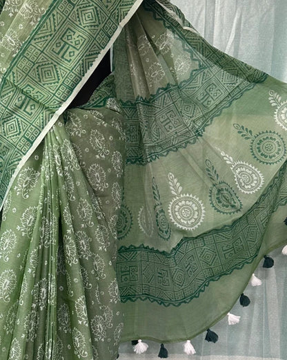 Green muslin saree floral print with black and white tassel detail