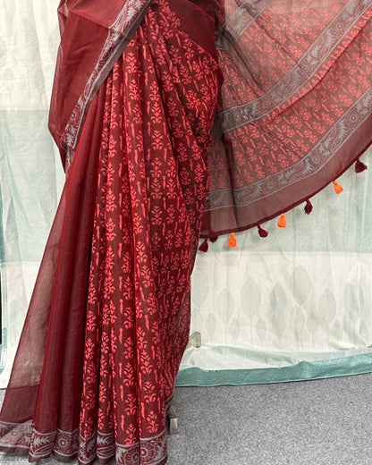 Maroon saree draped showing floral block print and silver border