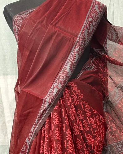 Maroon saree with silver floral border styled on mannequin