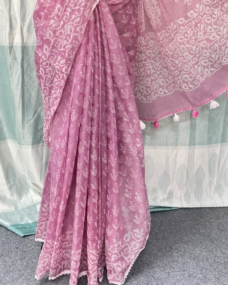 Mauve pink batik print saree draped showing tassel border