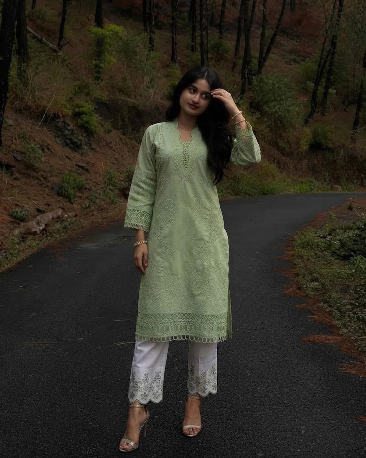 Woman wearing mint green full embroidered cotton 3pc suit with white embroidered trouser