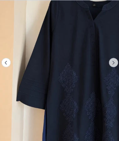 Close-up of diamond embroidery and pintuck sleeve on navy blue cotton kurta