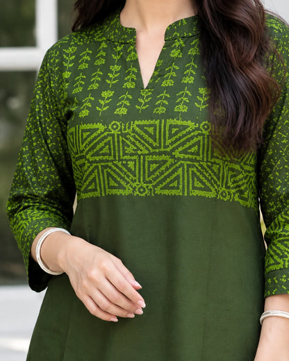 Close-up of notched neckline and block print yoke on olive green cotton kurta