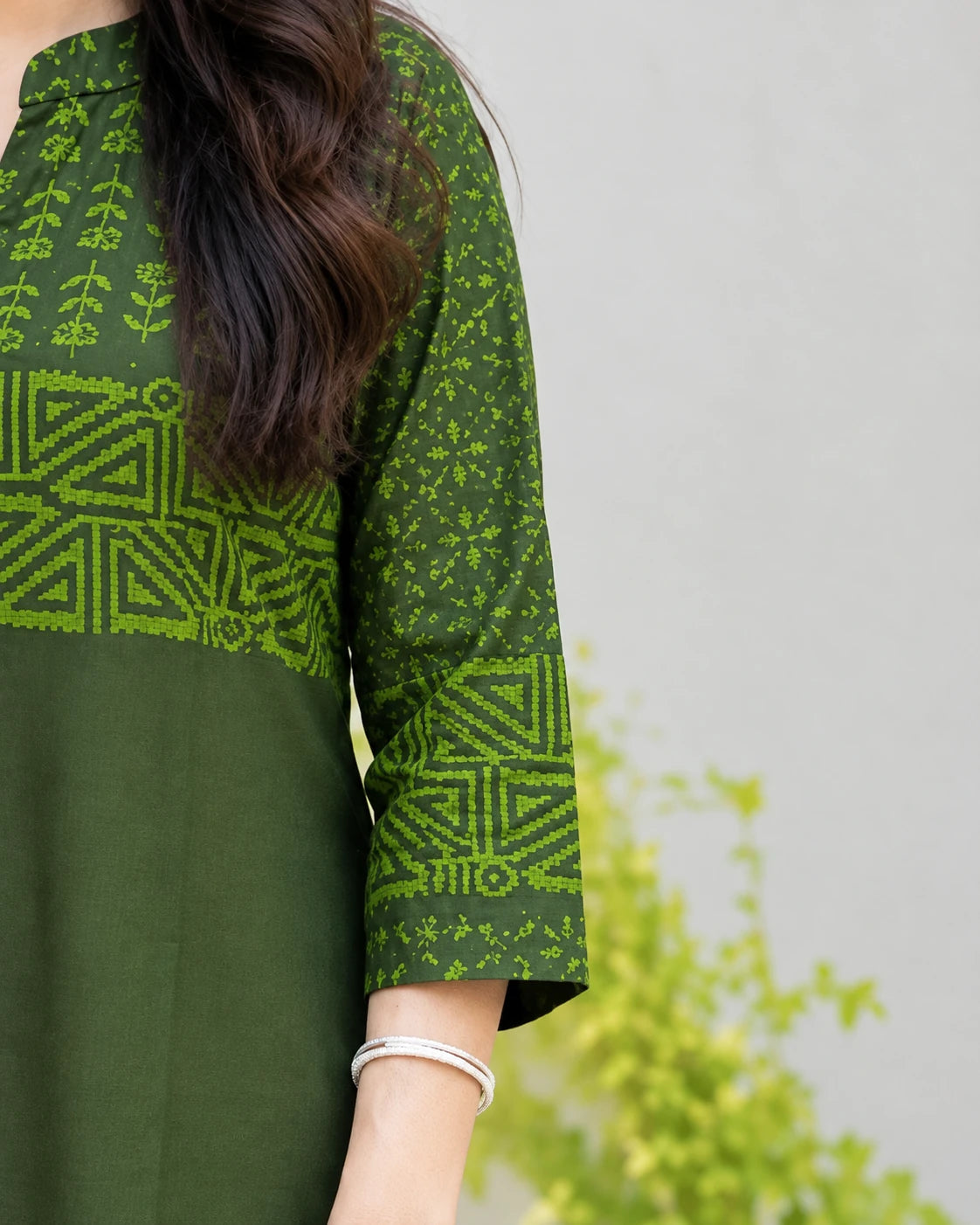 Close-up of 3/4 sleeve with block print band on olive green cotton kurta