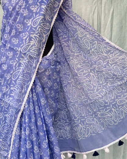 Close-up of periwinkle blue batik saree pallu with tassel border