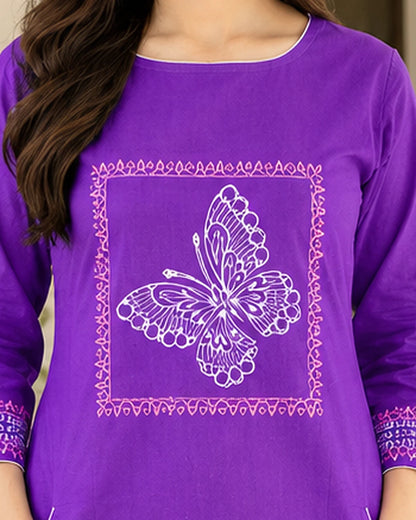 Close-up of round neckline and framed butterfly block print on purple cotton kurta