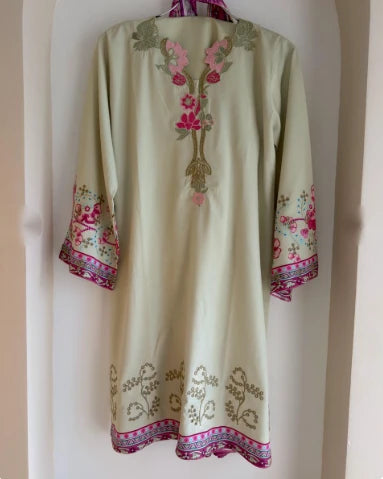 Sage green silk kurta with floral embroidery on neckline and hem