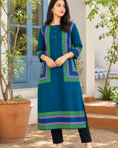 Woman wearing teal blue block print cotton long kurta with green and magenta borders