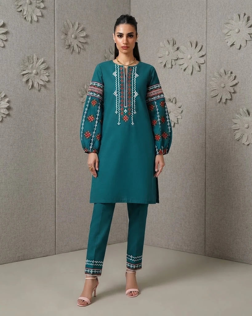 Woman wearing teal embroidered cotton two-piece set, front pose