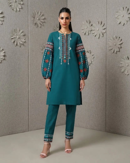 Woman wearing teal embroidered cotton two-piece set, front pose