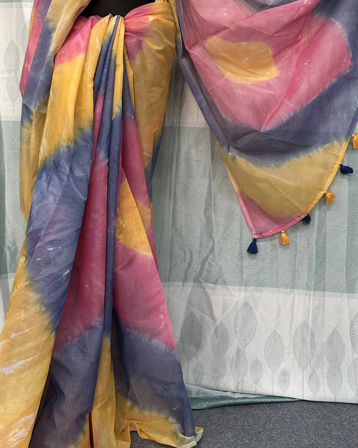 ie-dye batik saree draped showing tassel border detail